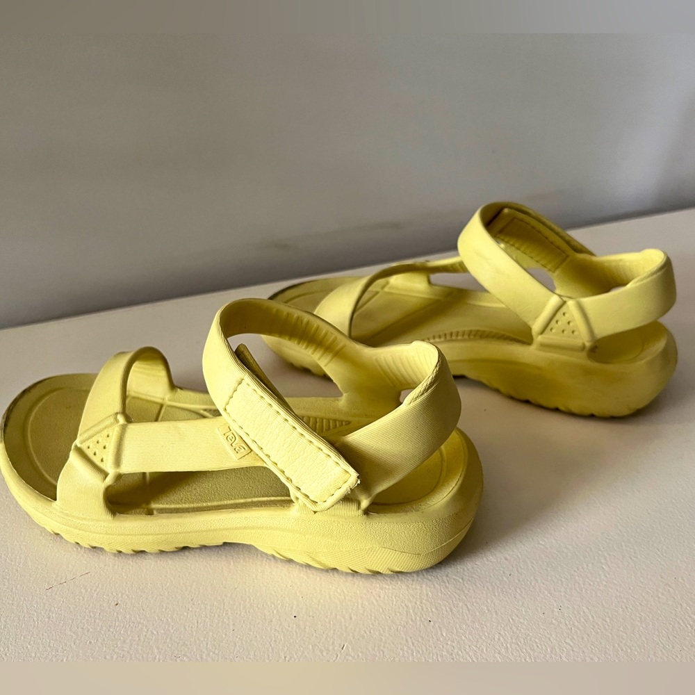 Bright yellow Teva sandals